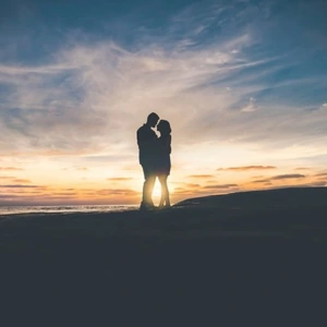 Couple on a hill embracing